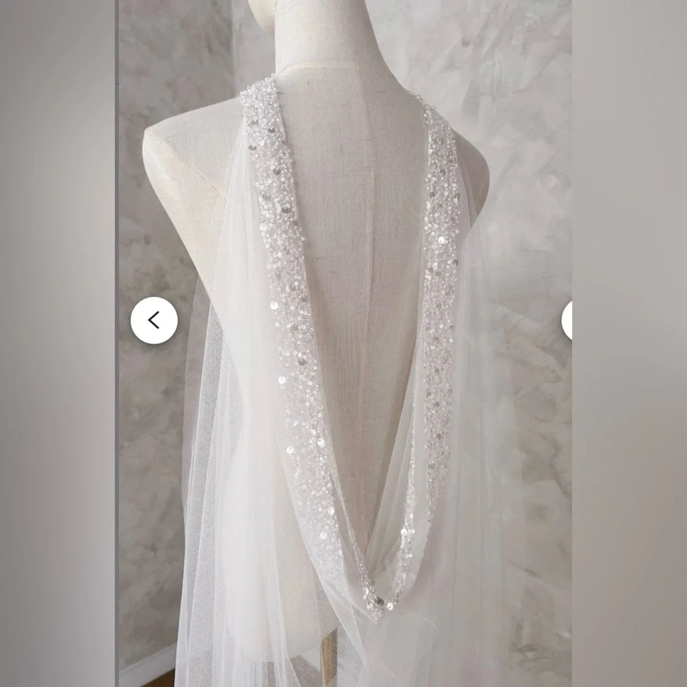 Elegant Ivory Beaded Bridal Cape with Floral Details - Picture 4 of 9